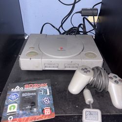 Playstion One with three  controllers