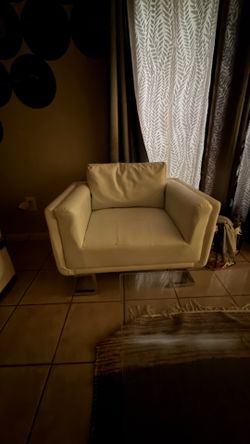 Two matching white chairs