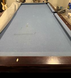 8ft pool table /sticks included , Paid $4000