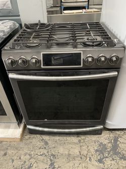 Samsung 30” slide in gas range in black stainless used