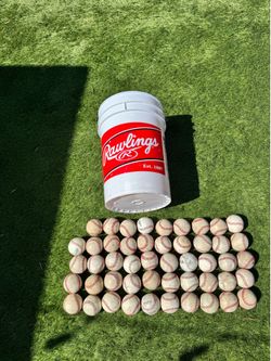 Bucket with 49 baseballs