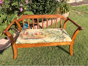 Wooden bench with upholstered seat