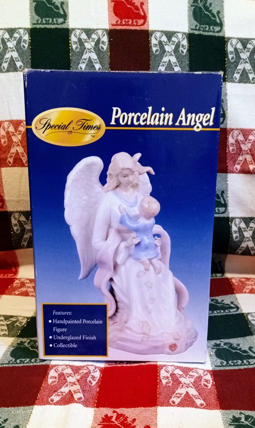 Hand Painted Porcelain Angel Holding A Young Child
