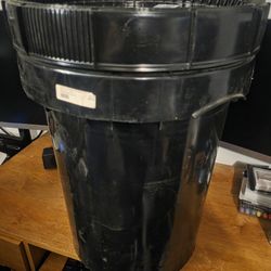 Black, heavy-duty plastic storage container with lid