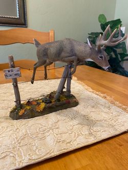 Deer sculpture by artist Curtis Christensen . “Out of Bounds .” 8 x 7 inches. Cabin / Rustic/ Cottage.