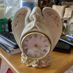 Beautiful angel clock with flowers on the bottom around the wings.    Or Best Offer Thumbnail