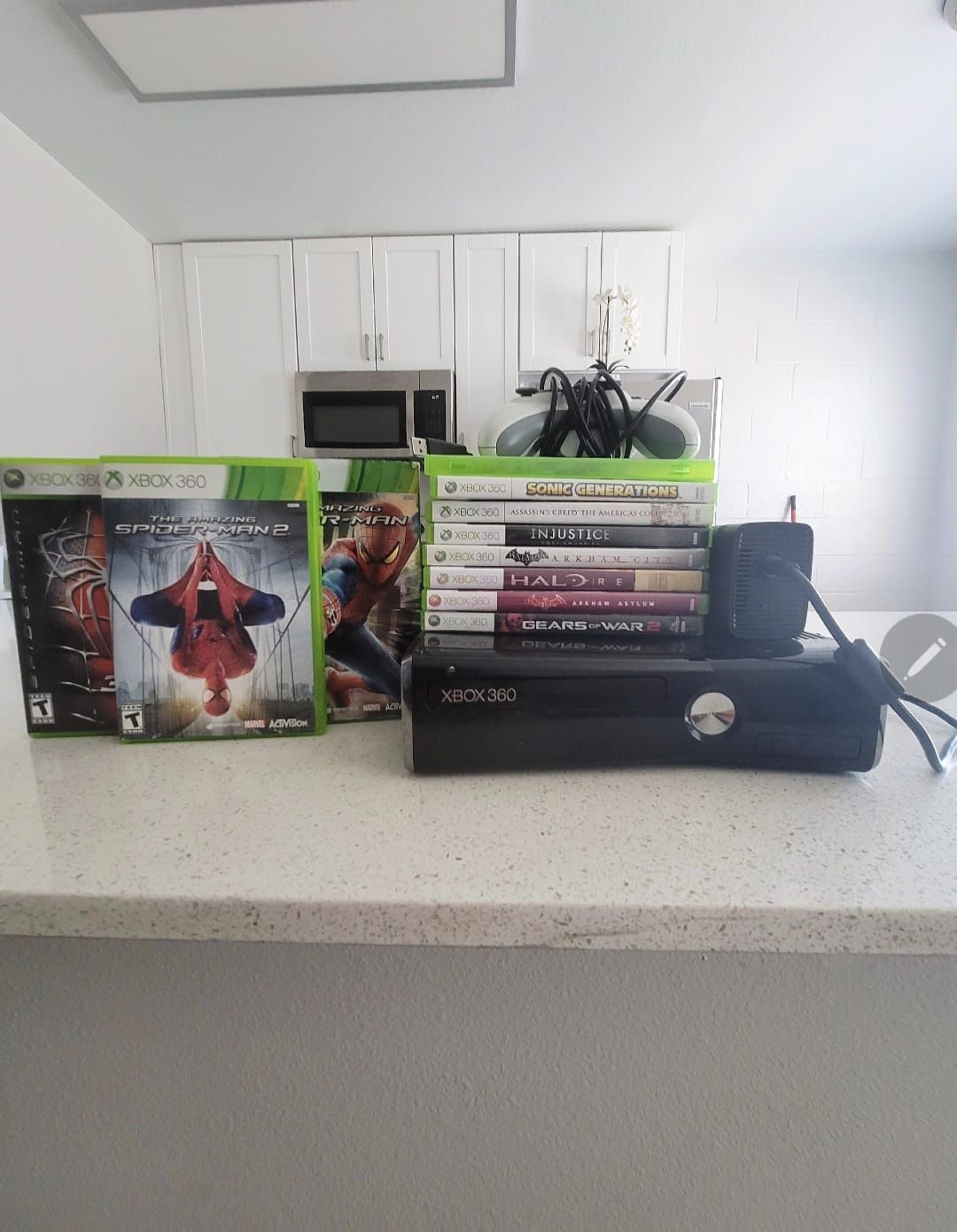 Xbox 360 Slim with all the games includes with also the Controller and all the you need