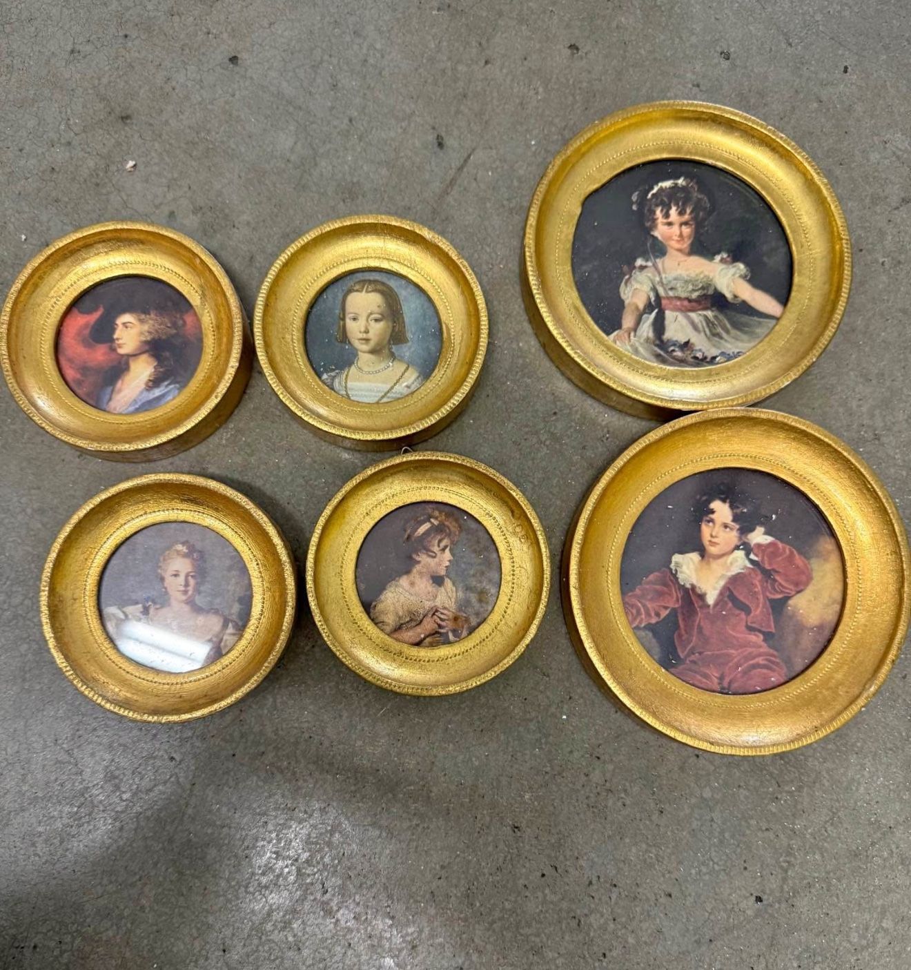 A set of miniature vintage framed portraits in Florentine frames.