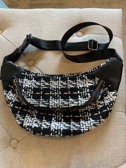 Black and white patterned waist bag with adjustable strap
