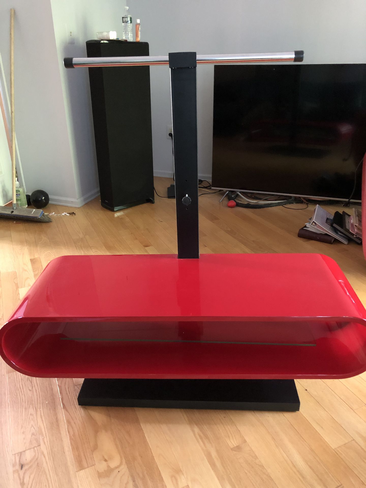 Contemporary red TV stand with glass shelf