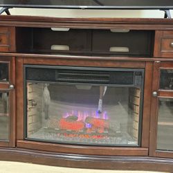 Wooden Tv Stand With Cabinets & A Fire Place 