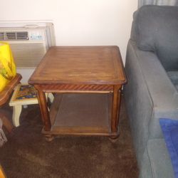 Two end tables and a coffee table with storage compartment