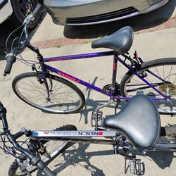 TWO BIKES PURPLE TREK MULTI TRACK 700, AND GRAY HUFFY ROCK CREEK 24