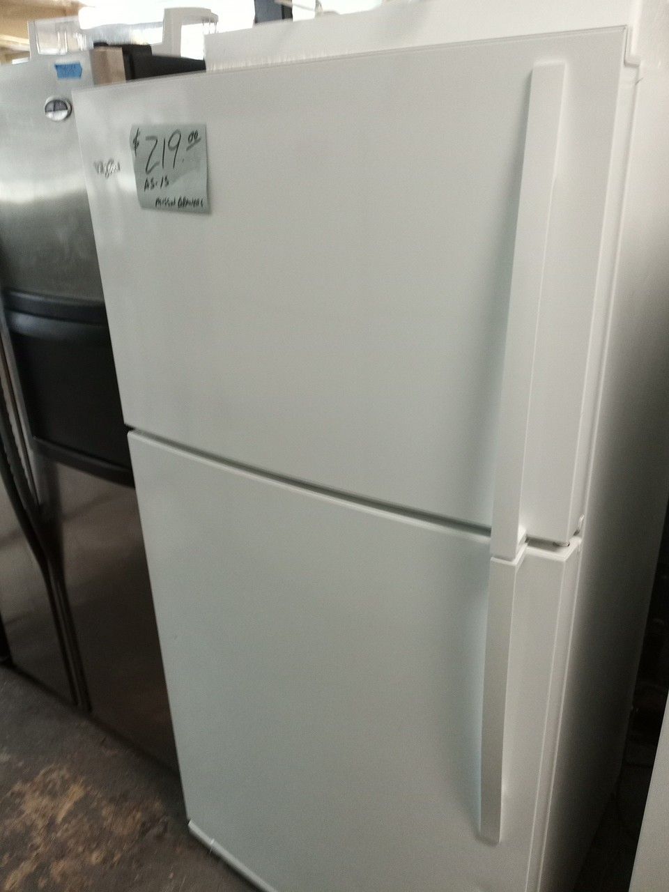Whirlpool refrigerator like new white missing door pockets . Warranty . Delivery available . 2203 Fowler st. Ft. Myers 33901