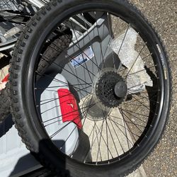 Giant factory 26” replacement rear wheel New. 8speed cassette with quick release ( in the plastic rapper in the spokes. With new Kenda Nevegal tire ( 