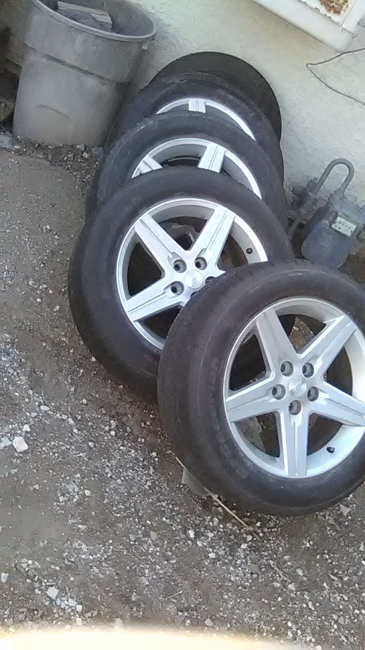 Rims with tires 5 lug, 245/55R18. OBO. Need gone today . Negotiable