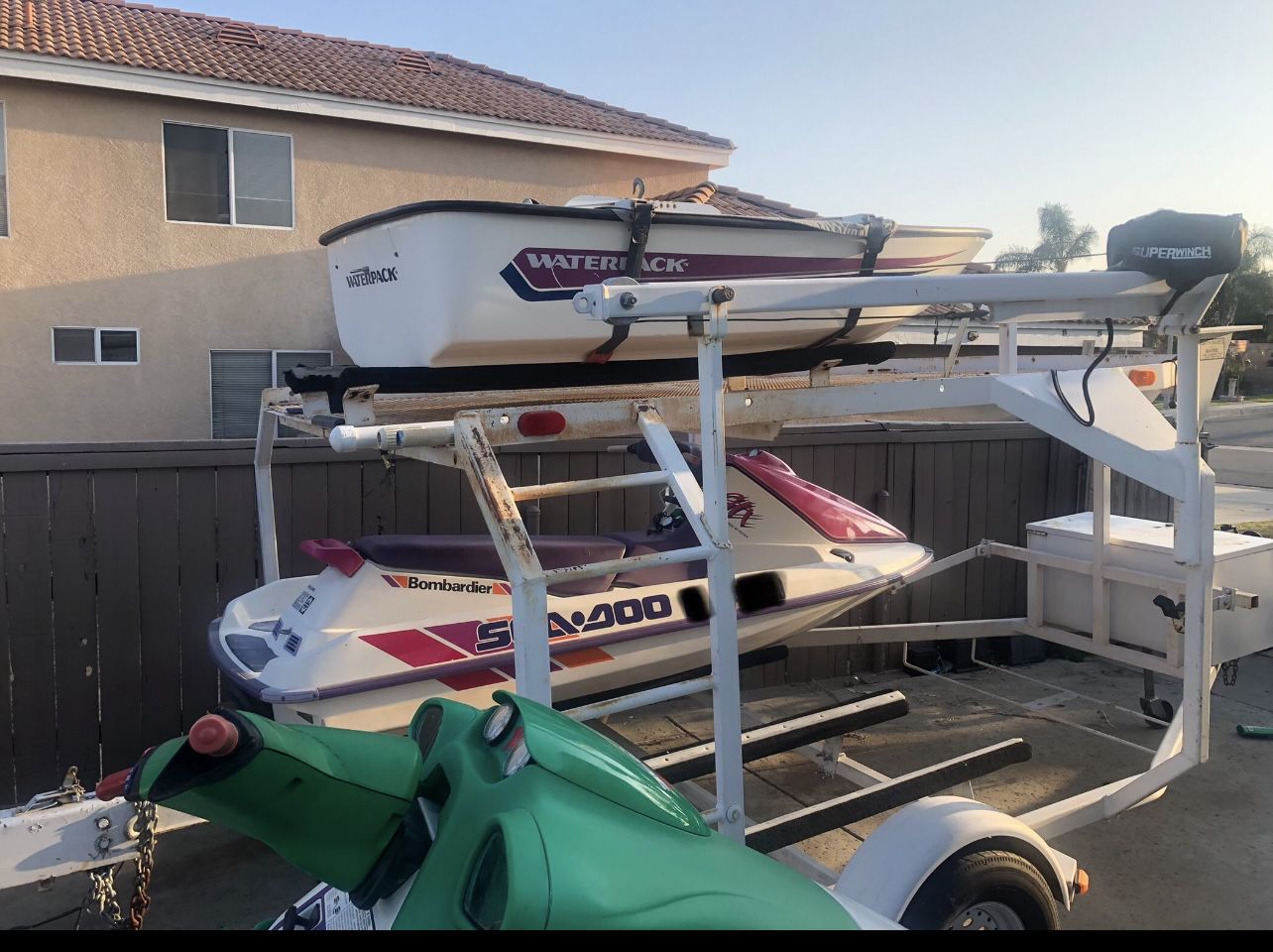 1993 Double trailer and two Sea-doo jet skis and a water pack boat