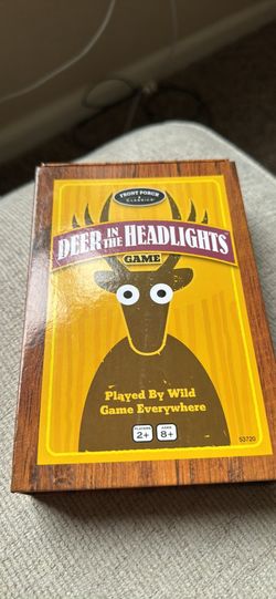 Board game with dice and cards deer in the headlights