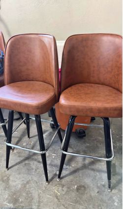 4  brown upholstered bar stools