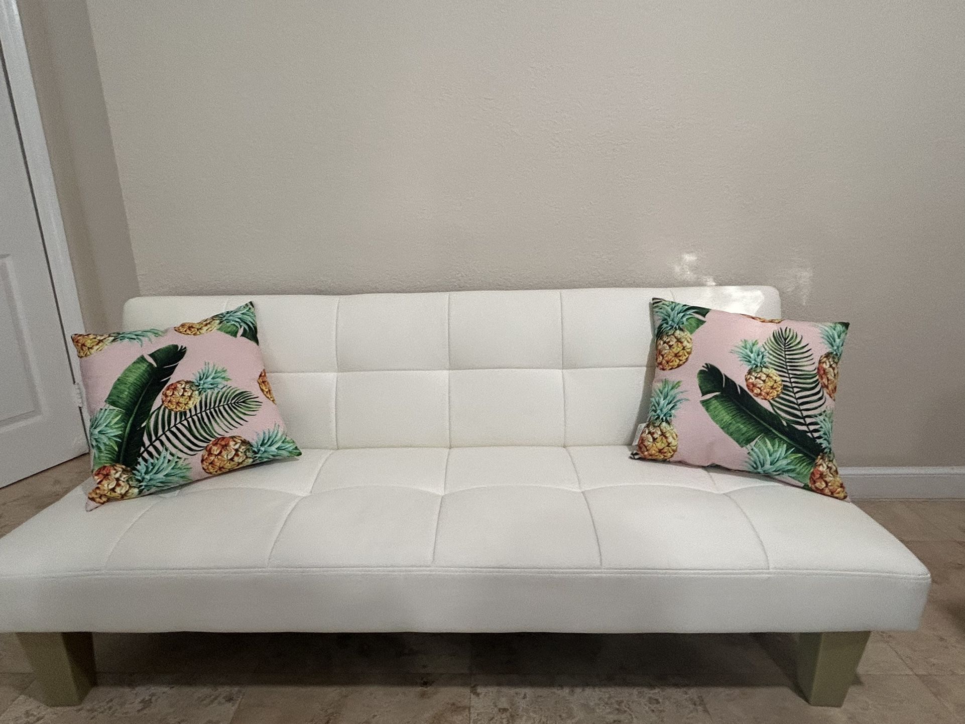 White Faux Leather Futon With Tropical Pillow 