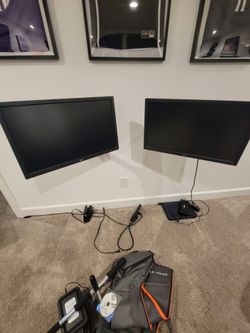 Two 24inch LG flat screen monitors with wall mounts