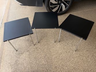 3 stackable nesting tables. Plastic and metal legs