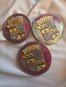 CADILLAC ROUND RED CAP EMBLEM FROM HUBCAP