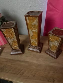 3 candle holders 7, 9 and 11 inches tall  $10