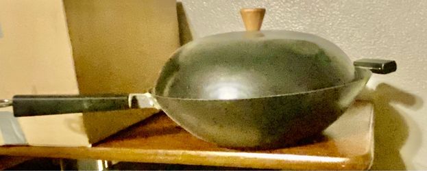 Vintage carbon steel spinning wok with a domed lid and long dark handle Up to $35. NOW $15