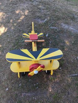 Kids solid wooden air plane on wheels works great