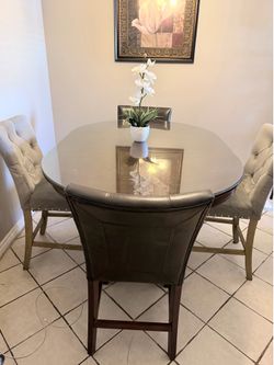counter-height dining table set featuring an expandable pedestal table base, typically known as the Coaster Home Furnishings Lavon Dining Set.