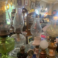 Antique oil lamps of all sizes and shapes.  Prices between 10 to 35.00.  Johanna at Antiques and More. Located at 316b Main Street Buda. Antiques vint