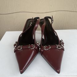 Burgundy patent leather pointed-toe slingback pumps