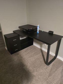 Black desk with drawers and shelves