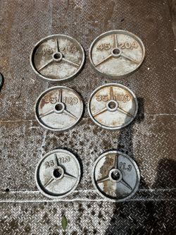 Pair of 45 35 and 25 Olympic size weight plates