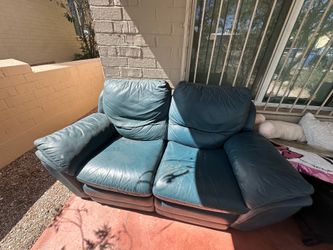 Blue leather couch with recliner seats