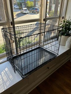 2 dog crates 1 medium 1 small and one cloud bed