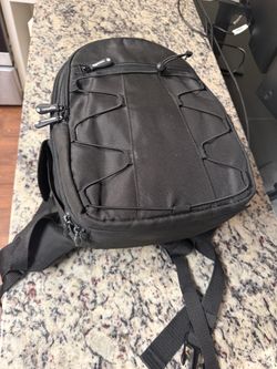 Black AmazonBasics Backpack (for camera and equipment)