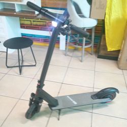 QINGOR FOLDING ELECTRIC SCOOTER MOTOR 350W POWER. SPEED MAX 19MPH, RANGE 17-20 MILES. SOLID TIRES. FRONT SUSPENSION. 