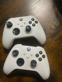 Two Xbox Wireless Controllers White and Green