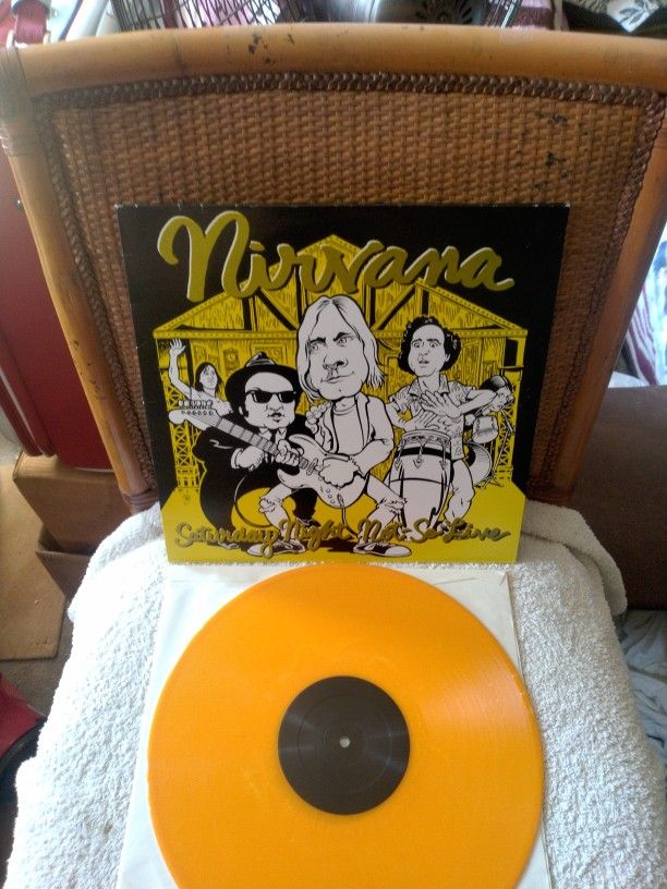 Nirvana - Saturday Night Not So Live. On Orange Colored Vinyl. Cover has some little creases, Vinyl is in Excellent Condition.
