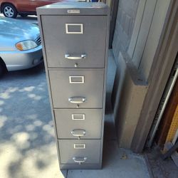 Tall Filing Cabinet. Drawers Roll Without Issues 