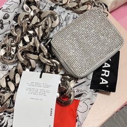 Never worn, with a tag and original dust bag. 
KARA Crystal mesh wrap mini shoulder bag in silver.
Shiny silver bulky brass chain and zipper...