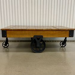Rustic reclaimed wood w/ cast iron wheel coffee table