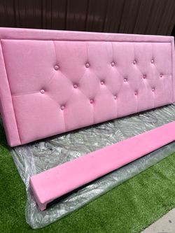 Full-size bed frame with a pink headboard new in box