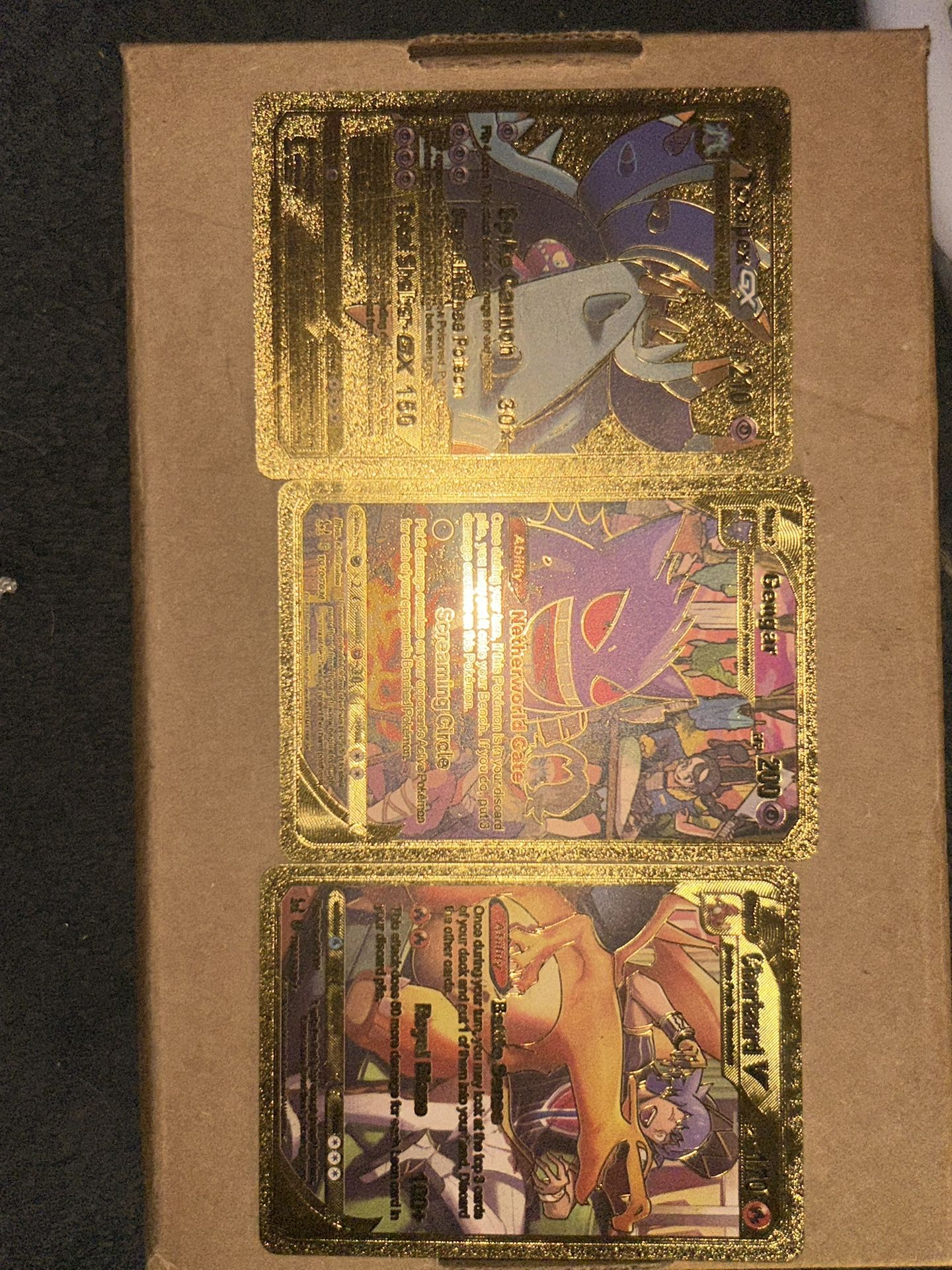 Three individual gold plated Pokémon cards