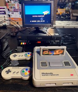 Super Famicom/Nintendo game console with games.