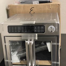 Emeril Lagasse 26QT Extra Large French Door Air Fryer Toaster Oven Combo  Open box item is new Amal dents on the back pls see pics!  This Emeril Lagas