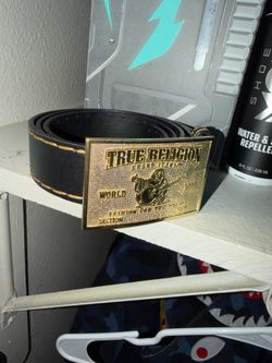 Black true religion belt with gold buckle and stitching