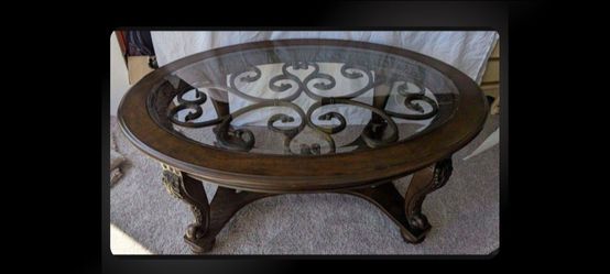 Wood Coffee With Glass  Inset and decorative metal Table
34"D x 20.25"H x 48"W